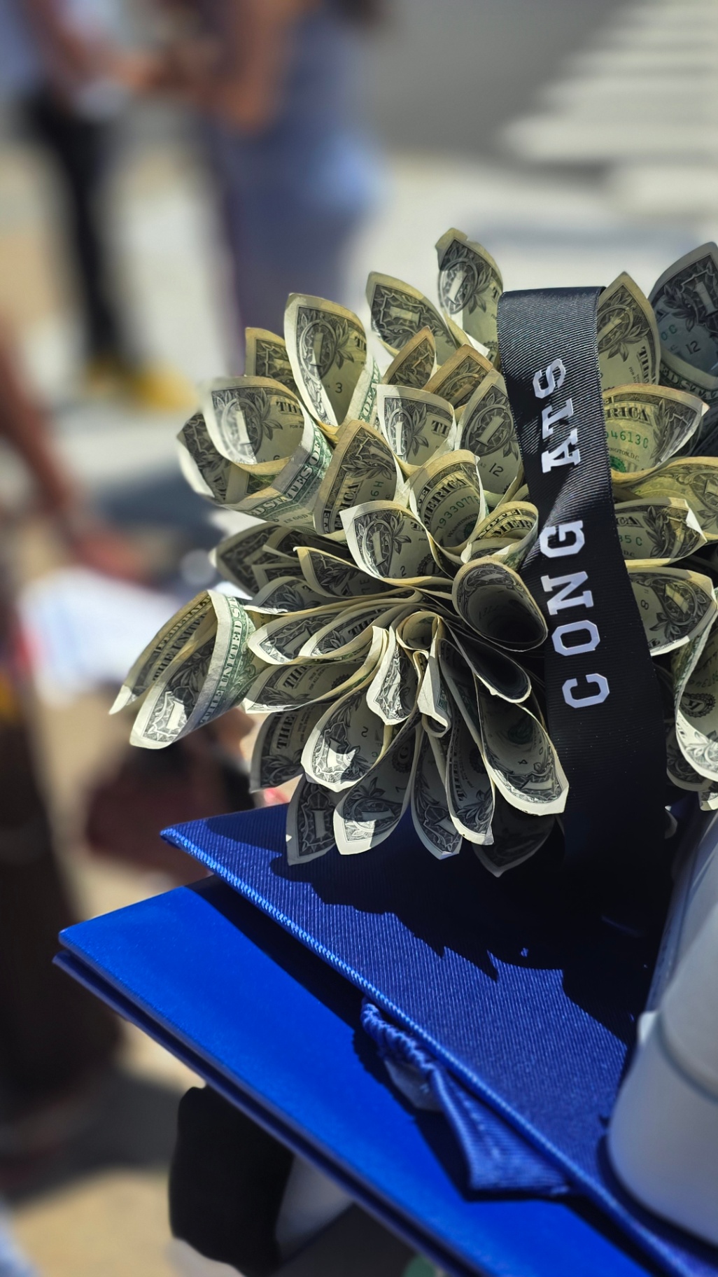 Congrats money bouquet on graduation cap