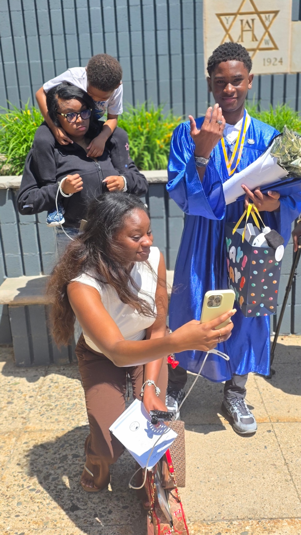 Family celebrating Zadon's graduation
