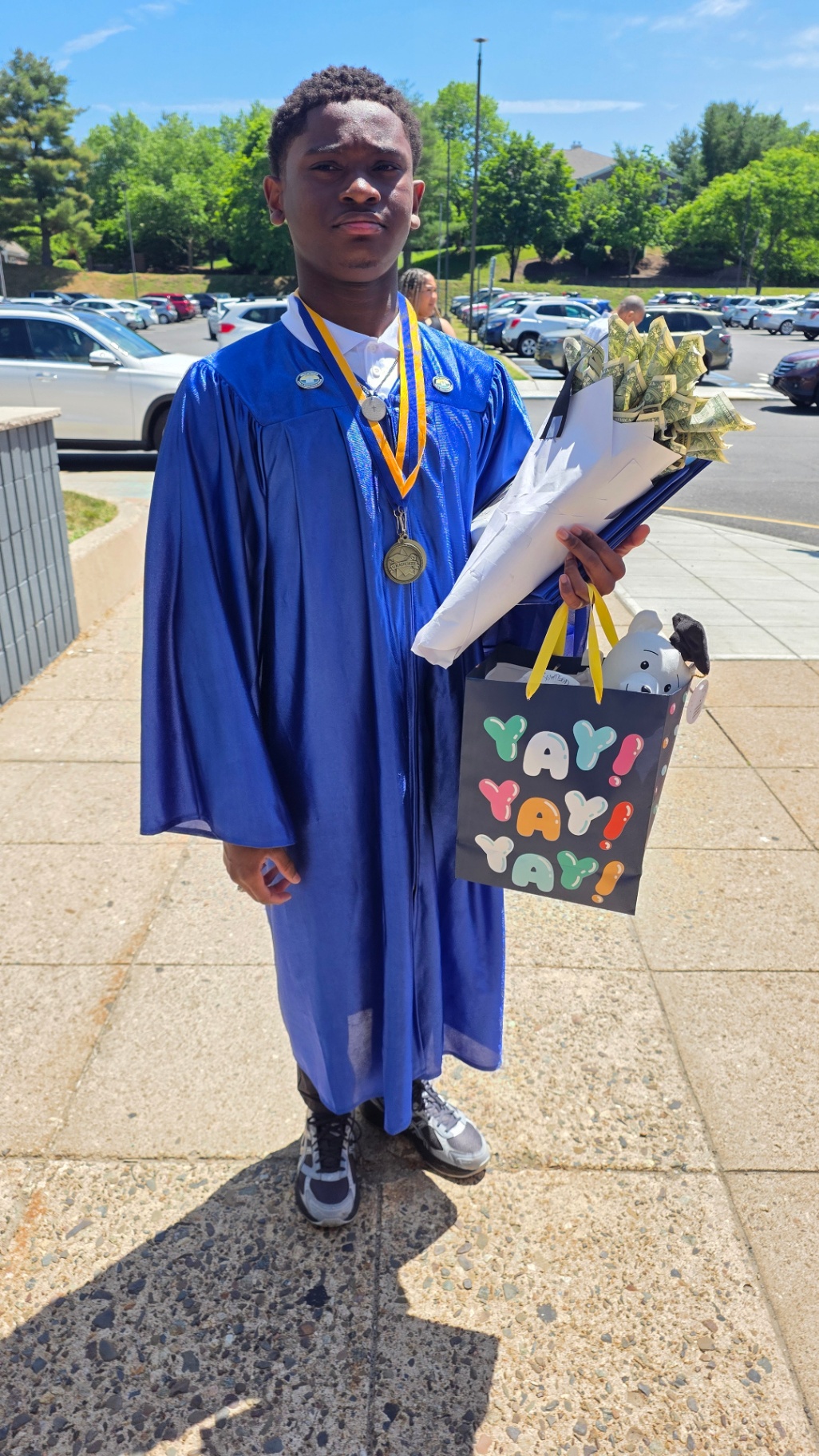 Zadon with bouquet outside school