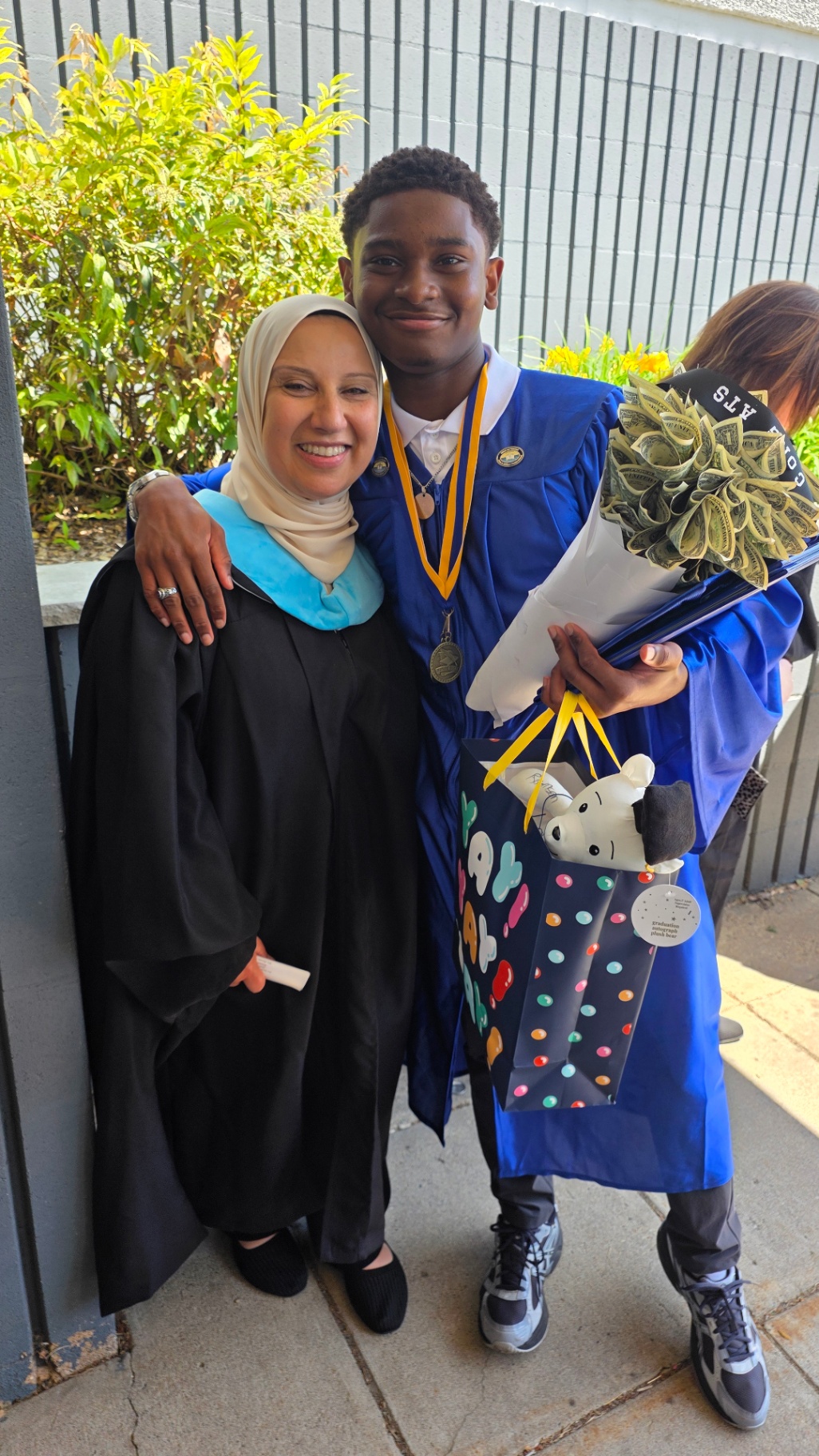 Zadon with teacher — graduation day