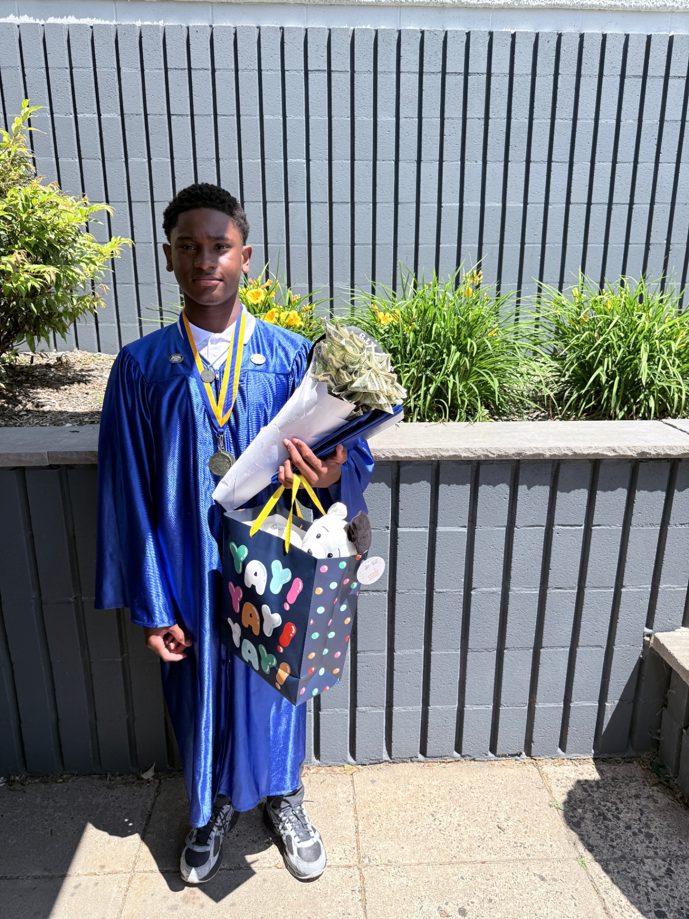 Zadon with medal, money bouquet, and gift bag