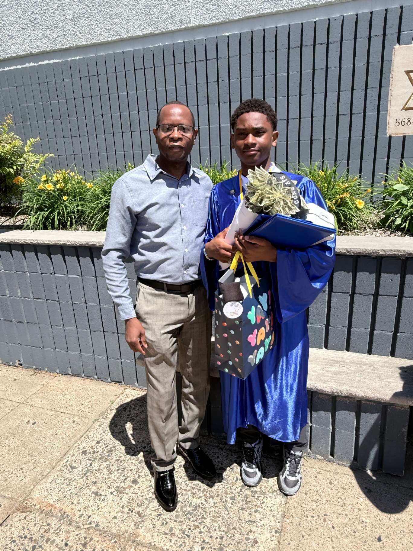 Zadon with dad after graduation