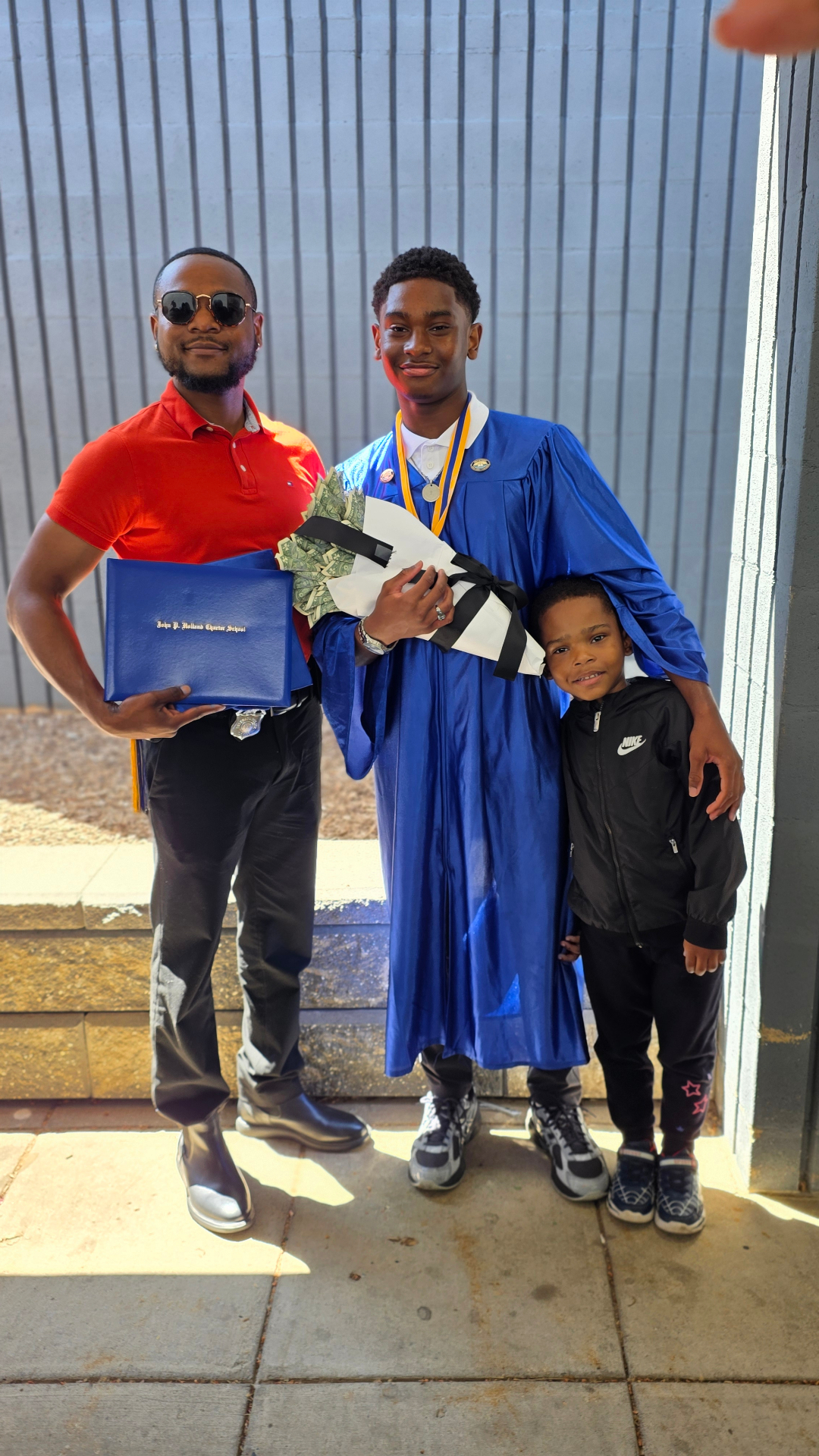 Zadon with dad and little brother after ceremony