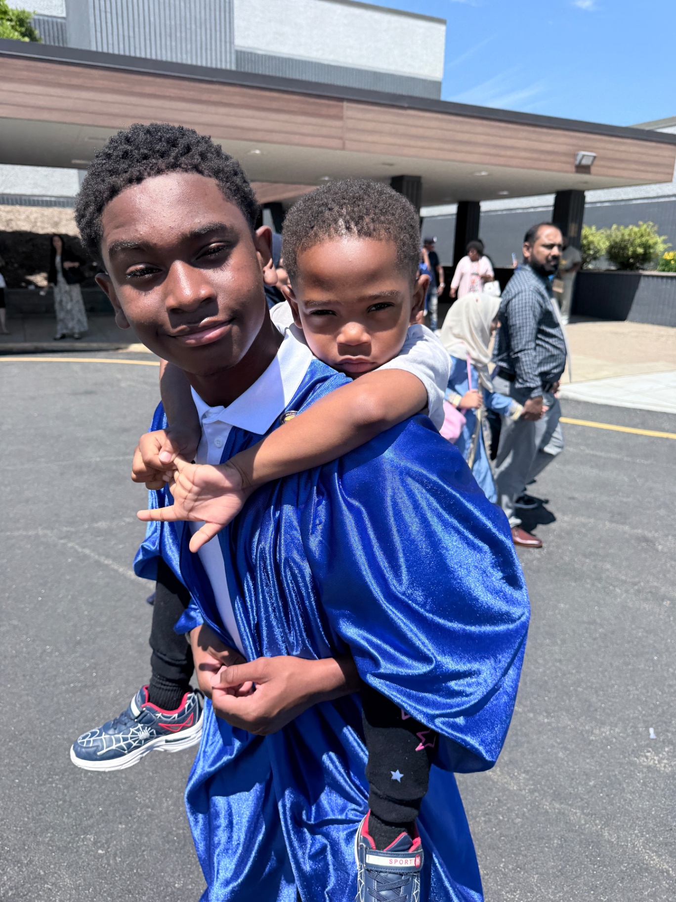 Zadon giving his little brother a piggyback ride