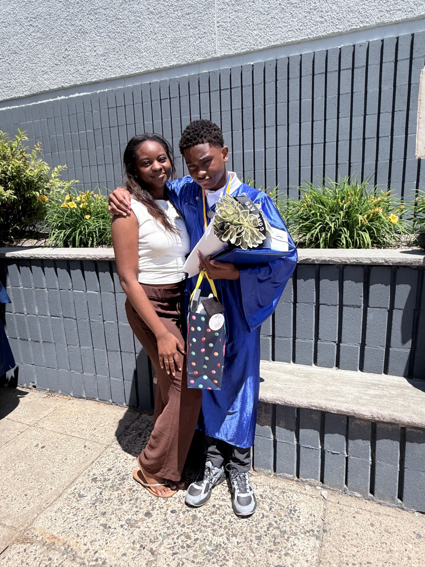 Zadon hugging his sister — celebrating the day